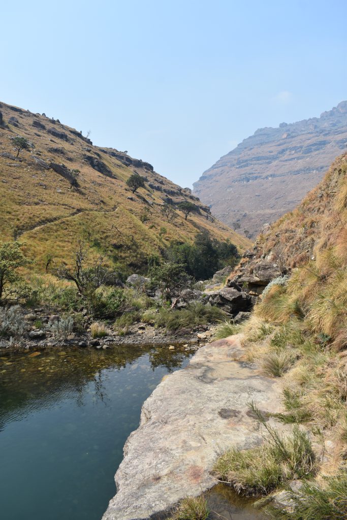 A mountain pool between rocky cliffs