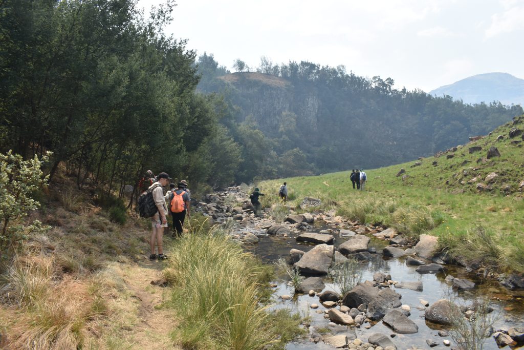 The trail following a stream through the mountains