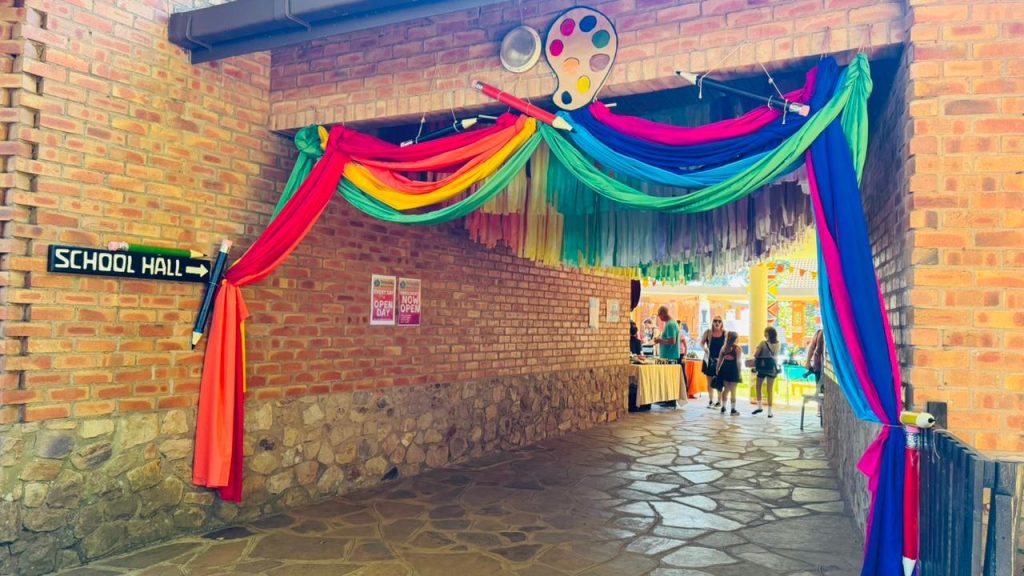 A rainbow of fabric draped over the entrance to the school hall for the Arts Festival