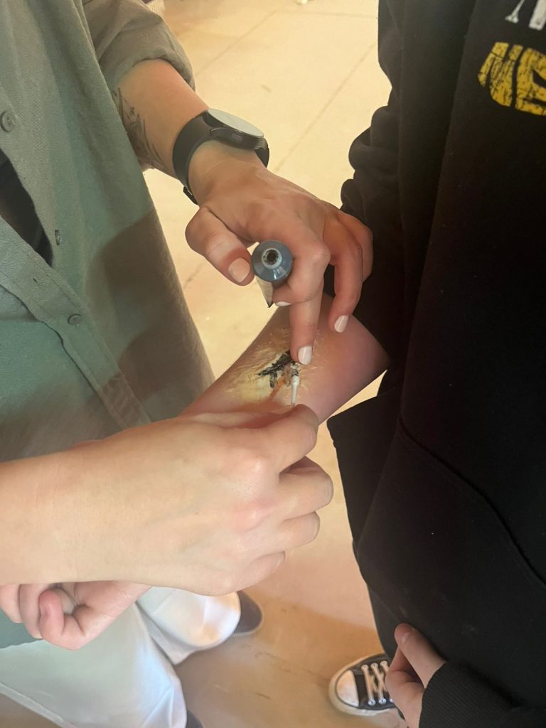 Special effects make-up being painted on an arm