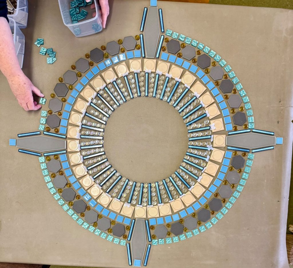 The mosaic compass taking shape